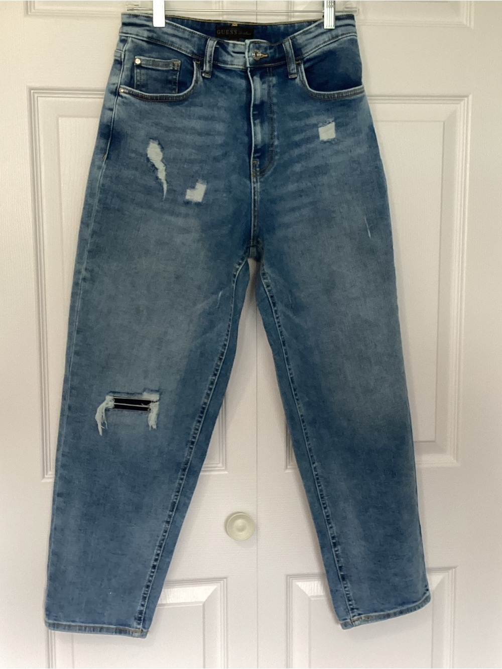 Guess Jeans, high rise, distressed details, straight leg, light wash blue denim.